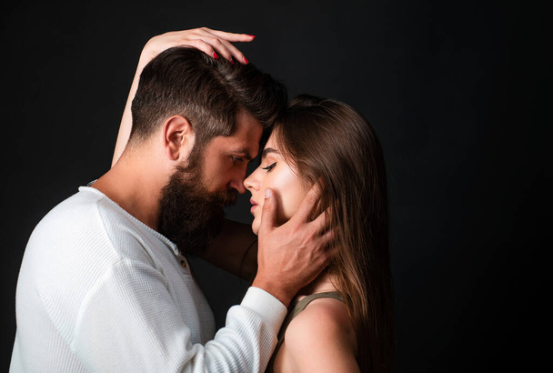 Loving man caressing hugging kissing woman. Sensual touch. Secrets fantasy. Satisfied girlfriend and boyfriend enjoying romantic moment - 写真・画像