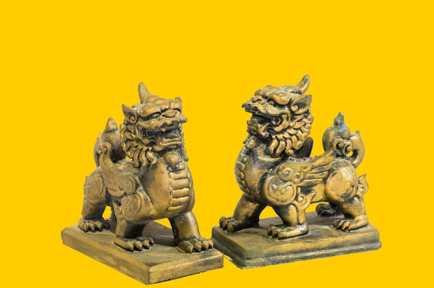 Chinese talisman figurine yellow background - Photo, Image