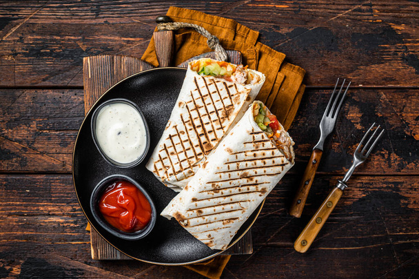 Shawarma, Shaurma chicken roll with vegetable salad. Wooden background. Top view. - Fotografie, Obrázek