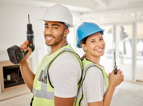 Workers, couple and portrait with construction tools, maintenance equipment and working contractor for renovation. People, back together and smile for home building, interior design or diy project. - Foto, Bild