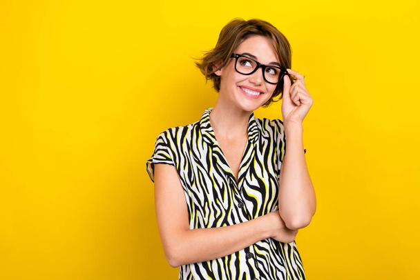 Portrait of adorable business lady wear specs look side empty space novelty information isolated yellow color background. - Foto, Bild