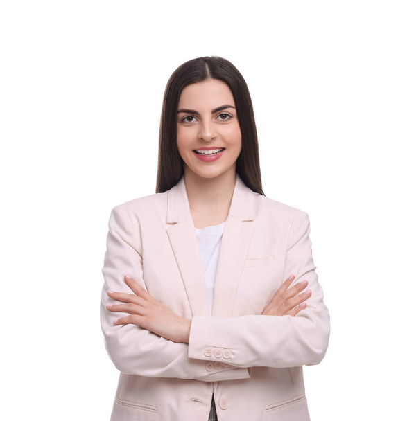 Beautiful happy businesswoman crossing arms on white background - Фото, изображение