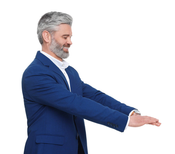 Mature businessman in stylish clothes posing on white background - Фото, зображення