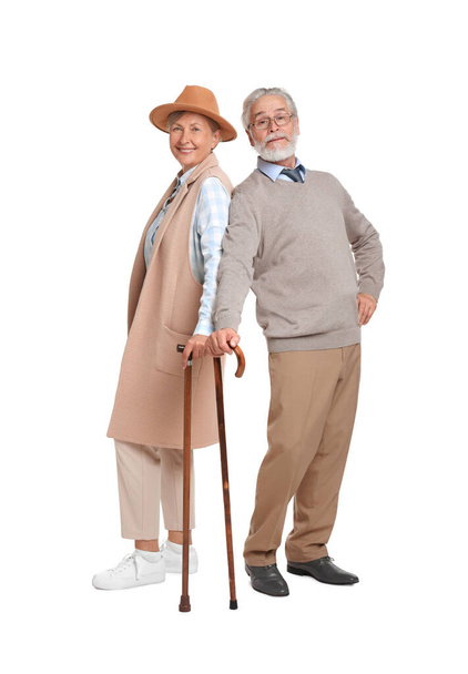 Senior man and woman with walking canes on white background - Foto, immagini