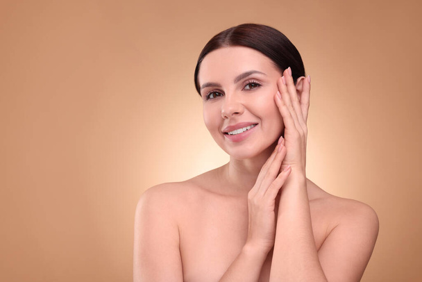 Beautiful woman with healthy skin on light brown background, space for text. Body Care - Foto, Imagem