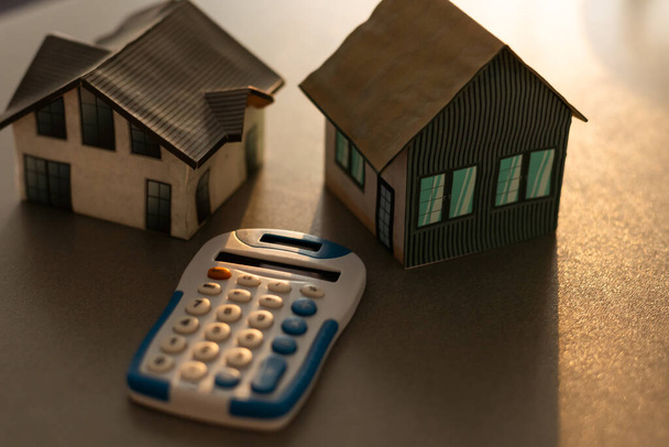Model house and calculator, achitektur and house building. - Photo, Image