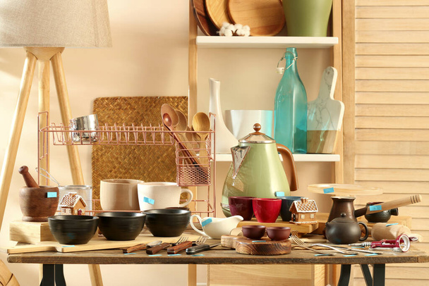 Many different cooking utensils in room. Garage sale - Foto, Imagem
