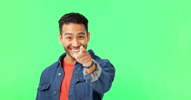 Man, come here hands and face by green screen with invite, excited and call by background. Young male student, welcome and pointing in portrait with mockup invitation for happiness by studio backdrop. - Záběry, video