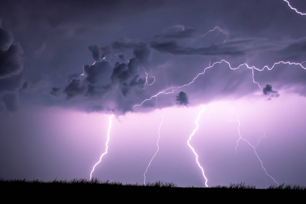 Ray. Lightning. Electric storm. Strong electrical storm with a multitude of lightning and thunder. Lightning storm over fields of Spain. Photography of lightning. - Photo, Image