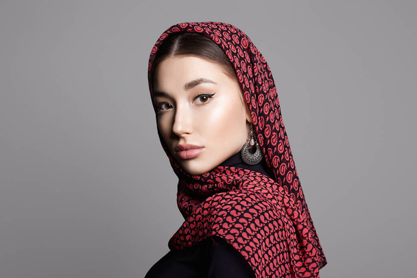 beautiful young woman in veil and jewelry. beauty girl in color hijab. fashion oriental woman - Fotó, kép
