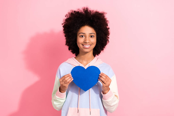 Photo of lovely cute person toothy smile hands hold paper blue heart symbol card isolated on pink color background. - Zdjęcie, obraz