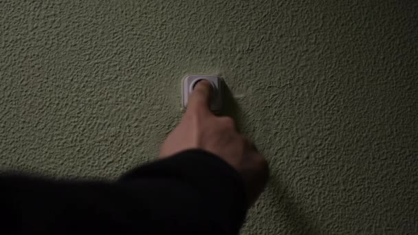 Close up of a male finger pressing a ring bell in the evening. Concept. Impatient man pressing button of a door bell  - Footage, Video