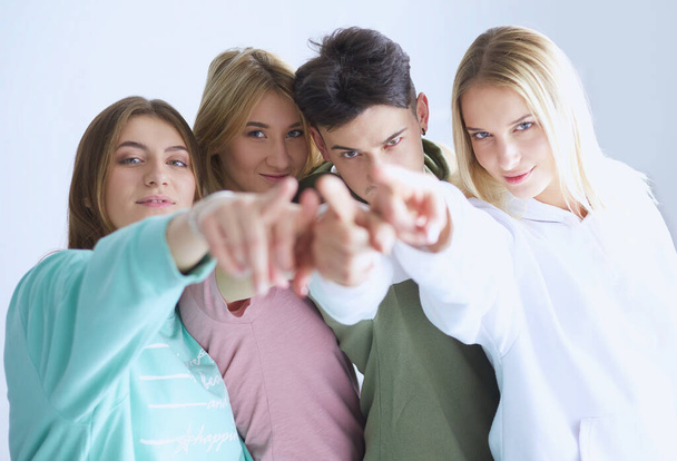 Young people pointing at you standing together. - Fotoğraf, Görsel