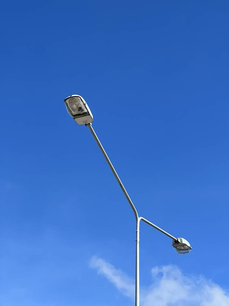 street light pole isolated on blue sky background  - Foto, afbeelding
