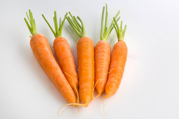 Carrots on white background - Foto, afbeelding