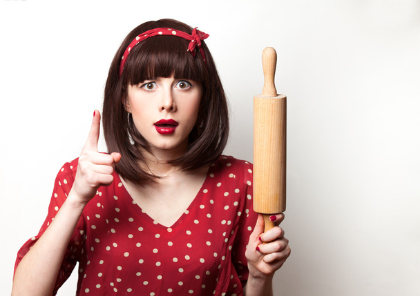 housewife red dress with rolling pin  - Photo, Image
