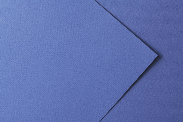Rough kraft paper pieces background, geometric monochrome paper texture blue color. Mockup with copy space for text - Photo, Image