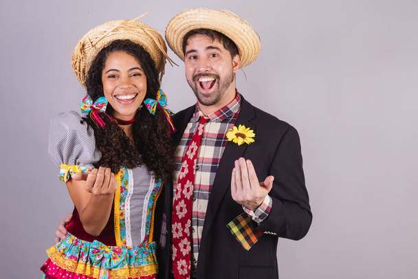 Brazilian couple, wearing June party clothes, fraternization in the name of So Joo, Arraial. close-up photo.  - Photo, Image