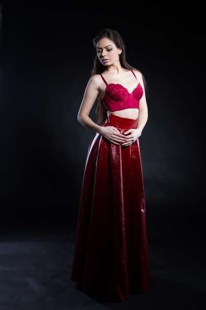 Young girl in a red skirt and bra - Photo, Image