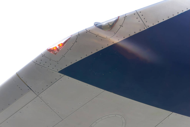 White and blue airplane wing with signal lights close up - Photo, Image