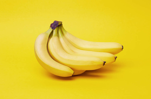 Bananas on a yellow background - Foto, Imagen