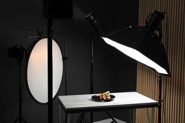 Composition with baked chicken, parsnip and strawberries on grey table in professional photo studio. Food photography - Fotografie, Obrázek