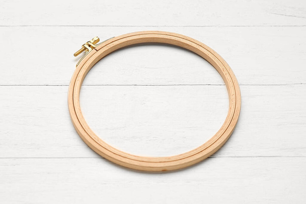 Embroidery hoops on white wooden background - Photo, Image
