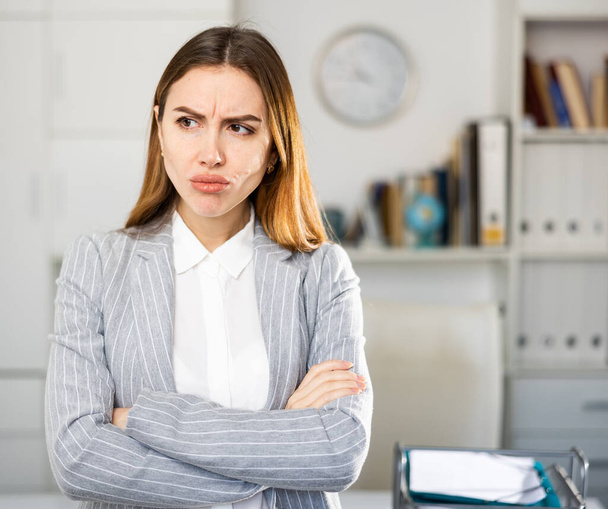 Portrait of pensive female manager in modern office - Foto, imagen