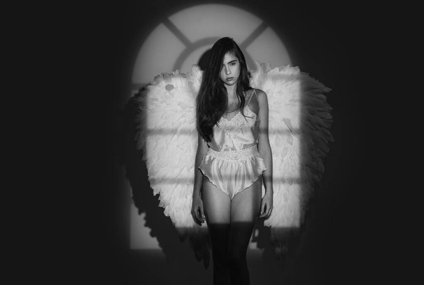 Angel girl. Angel woman with wings isolated. Long white wings. Valentines day and costumes concept. Valentines Day concept - Foto, immagini