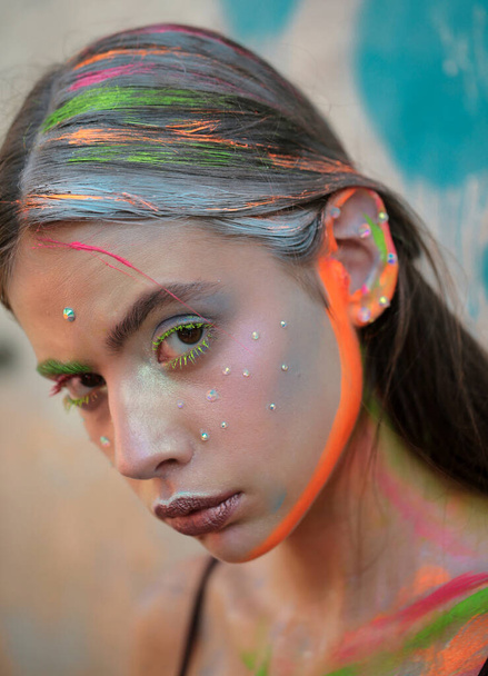 Art makeup. Fashion girl with colorful make up. Beauty woman with bright make-up. Closeup of vogue style face. Abstract colourful make-up - Photo, Image