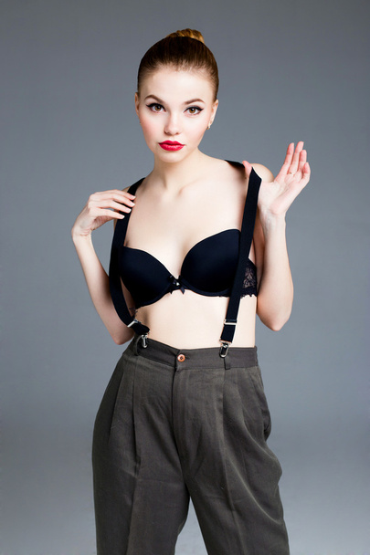 Female model wearing bra and suspenders - Foto, afbeelding