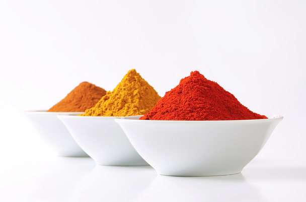 Curry powder, paprika and ground cinnamon - Photo, Image
