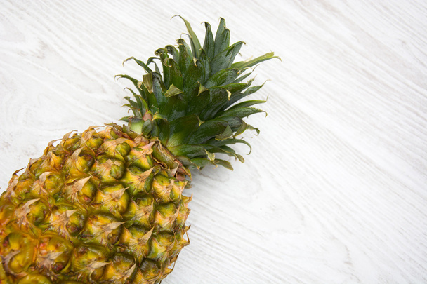 Pineapple on wood - Foto, afbeelding