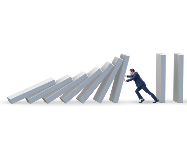 The businessman preventing domino effect in business concept - Photo, Image