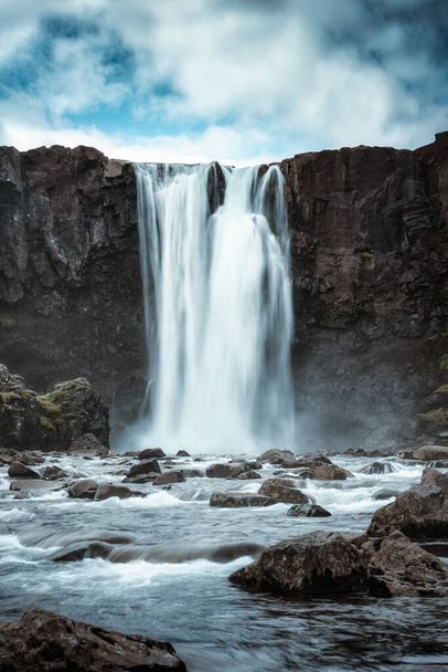Dramatic scenery of Gufufoss waterfall flowing on summer in east fjords at Seydisfjordur, Iceland - Valokuva, kuva