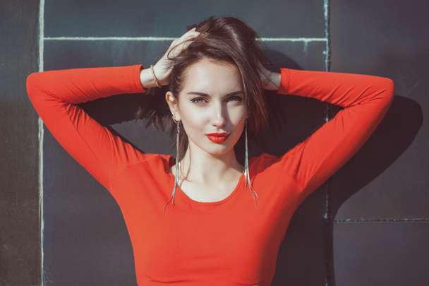 Young beautiful hipster girl in red blouse - Фото, зображення