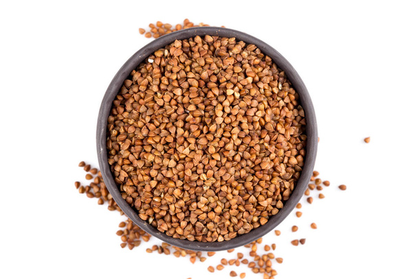 Buckwheat groats in a bowl, close up photo - Φωτογραφία, εικόνα