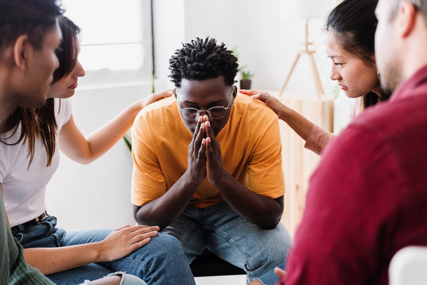 Group of people sitting in circle talking and supporting on therapy meeting at community center. Mental health and help concept. - Foto, Imagem