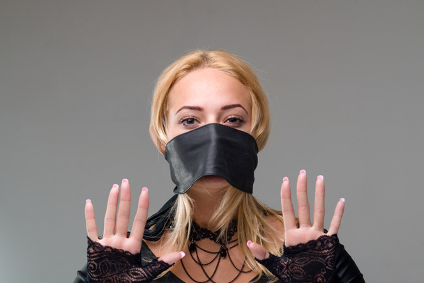 Woman with self-adhesive tape over her mouth - Foto, Imagem