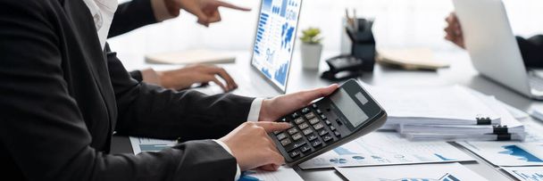 Auditor and accountant team working in office, analyze financial data and accounting record with calculator. Accounting company provide finance and taxation planning for profitable cash flow. Insight - Foto, immagini