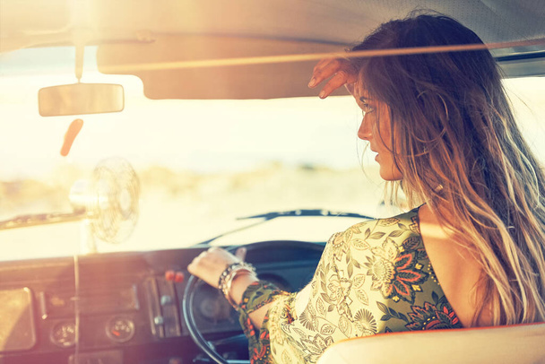 Time for another spontaneous road trip. a gorgeous young woman enjoying a roadtrip on her own - Foto, immagini