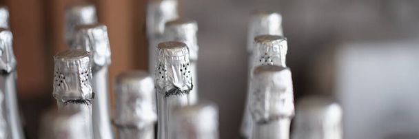 Silver bottles of champagne in row in bar. Party celebration concept - Photo, image