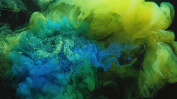 Color smoke. Paint water mix. Toxic fume. Chemical explosion. Green blue mist cloud blend floating on dark black abstract art background. - Photo, Image