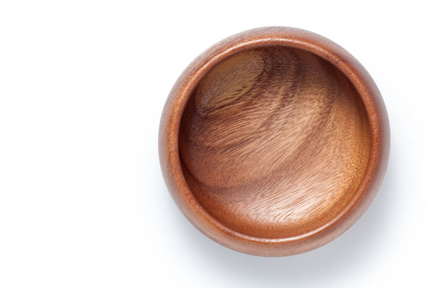 Empty wooden bowl isolated on white background. Top view. - Photo, Image