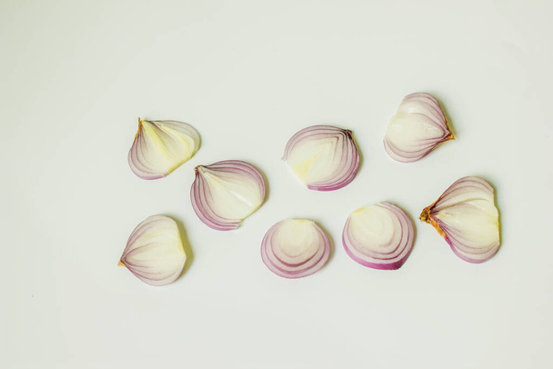 Thinly sliced onion on white background - Zdjęcie, obraz