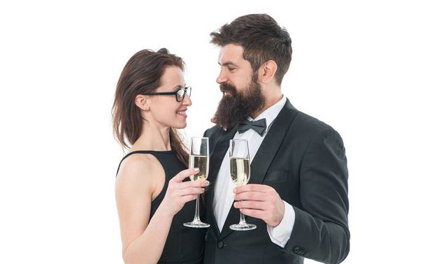 Falling in love. happy valentines day. couple in love. couple drink champagne. charity event for toffs. celebrate special occasion. confident and successful. tuxedo man with beard and elegant woman. - Fotografie, Obrázek
