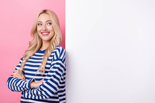 Photo of young optimistic attractive woman wear striped shirt crossed hands look empty space placard branding isolated on pink background. - Φωτογραφία, εικόνα