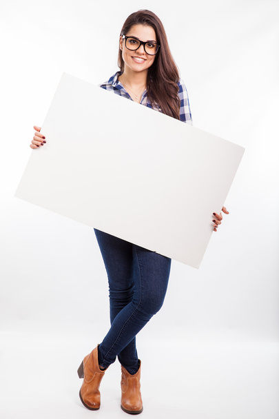 Woman holding a big white sign - 写真・画像