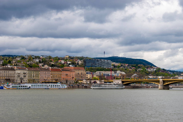 Budapest, Hungary - April 15, 2023 a delightful encounter the danube river, tourist ship, and the joy of exploration - Photo, Image
