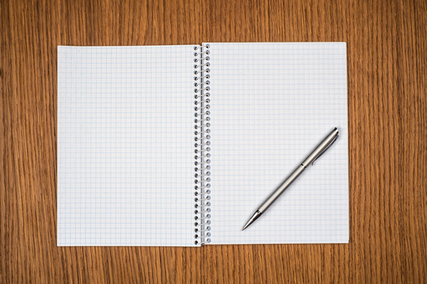 notepad with pen lying on the table - Fotó, kép